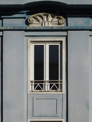 Streets of Lisbon. Beautiful Art Deco facade with window in the Quarter of Areeiro. Portugal.  