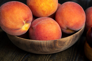 Fototapeta na wymiar Ripe fresh peaches on a wooden table