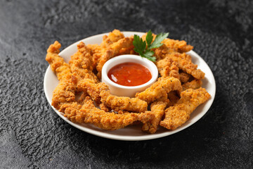 Crispy Shredded Chicken served with sweet chilli sauce. Party finger food snack concept