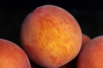 Ripe fresh peaches on a wooden table