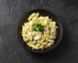 Creamy broccoli feta cheese pasta with pine nuts. Healthy food