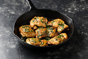 Homemade Chimichurri Chicken thighs ready to eat on iron cast pan