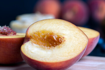 Ripe fresh peaches on a wooden table