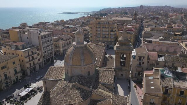 flying over church towards piazza in Gela Sicily