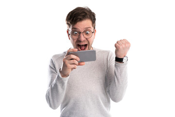 Happy man holding smartphone and celebrating his success over transparent background