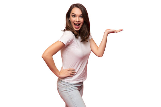 Photo of happy young woman standing isolated over transparent background. Looking camera showing copyspace pointing
