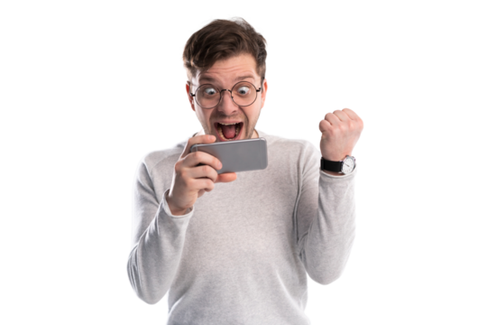 Happy man holding smartphone and celebrating his success over transparent background