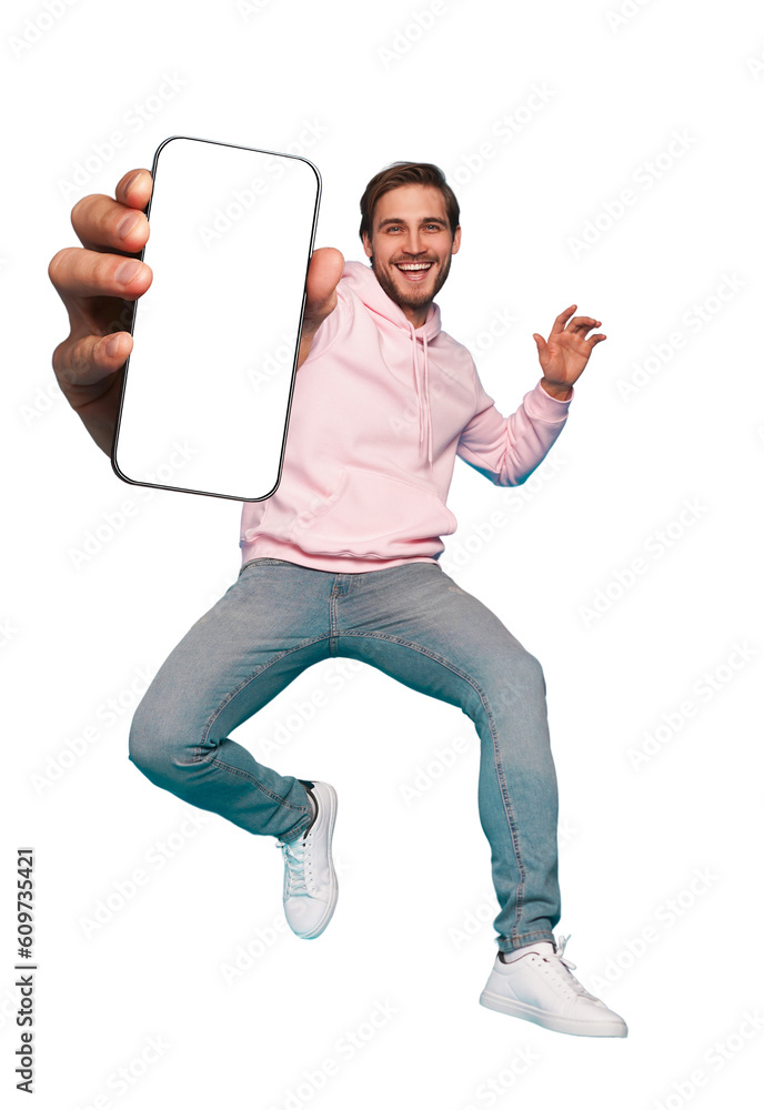 Wall mural mobile app advertisement. handsome excited man showing pointing at empty smartphone screen posing ov