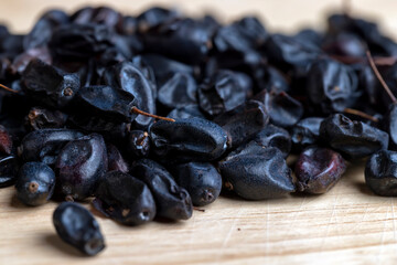 Black spices of dried barberry for cooking meat