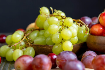 Naklejka na ściany i meble Large ripe grapes on the table