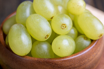 Homemade green unwashed grapes on a board