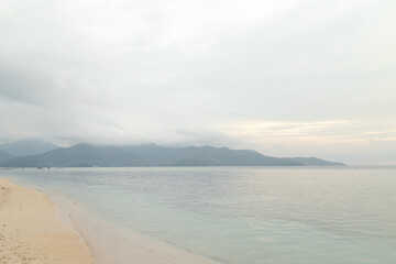 Lombok and Gili Air islands, overcast, cloudy day, sky and sea. Sunset, sand beach.