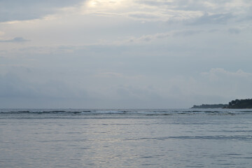 Lombok and Gili Air islands, overcast, cloudy day, sky and sea. Sunset, sand beach.