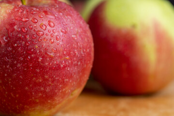 Fresh red and green apples on the kitchen table