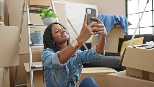 African american woman smiling confident make selfie by smartphone at new home