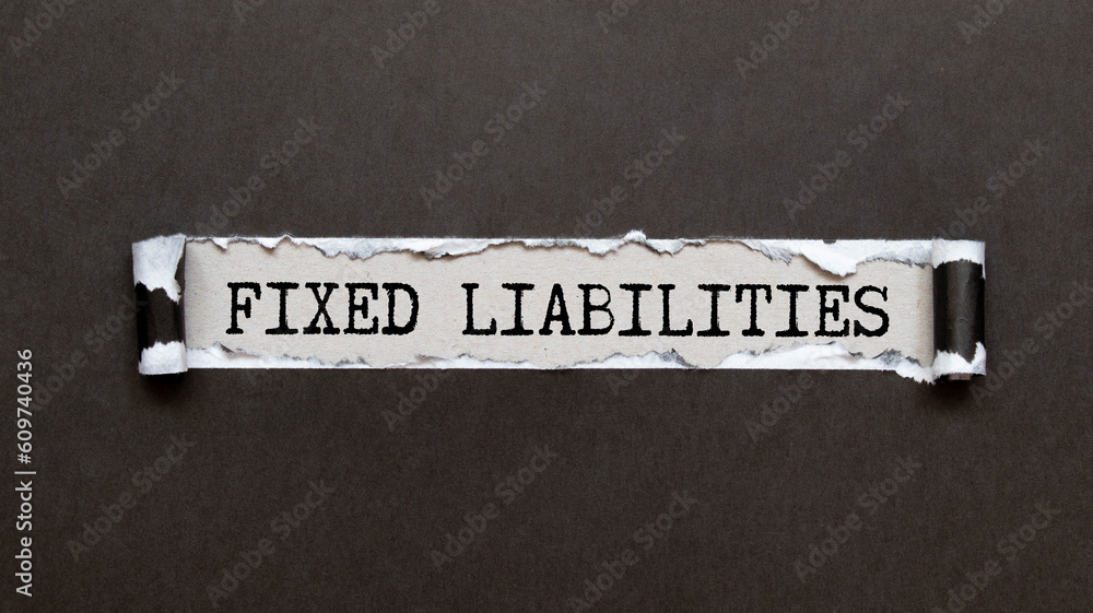 Poster asset liability text written on a notebook with pencils.