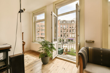 a living room with wood flooring and large windows looking out onto the cityscapea, amsterdam, netherlands
