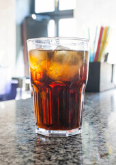 refreshing soda drink with ice at the bar