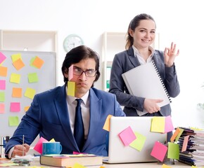 Two colleagues employees working in the office