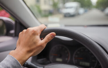 Car driving handle with hand: a symbol of control, independence, mobility, and the freedom of the open road
