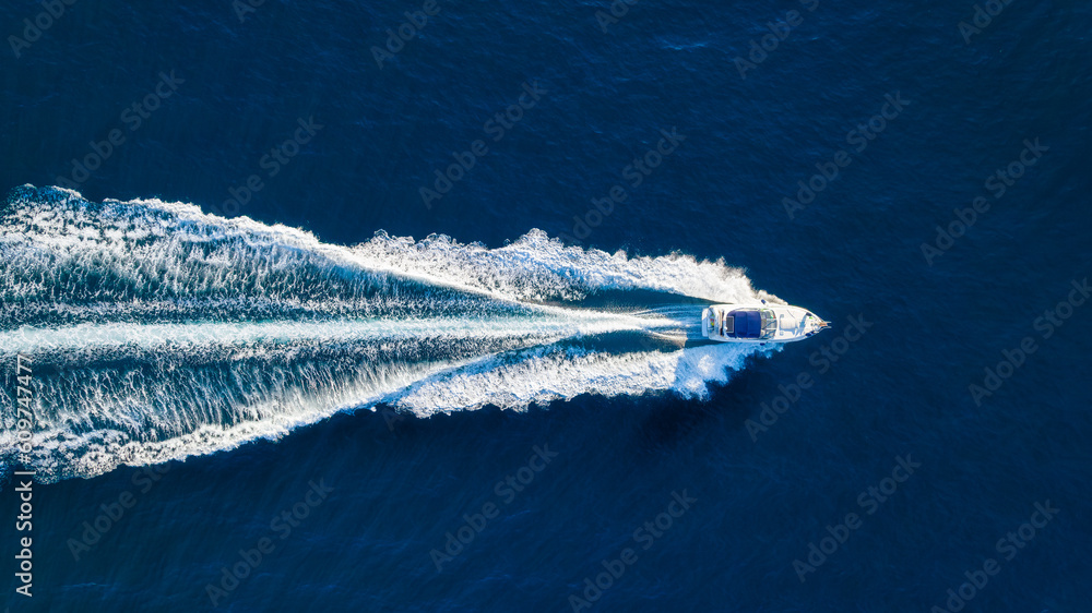 Wall mural vacation and leisure. aerial view on fast boat on blue mediterranean sea at sunny day. fast ship on 