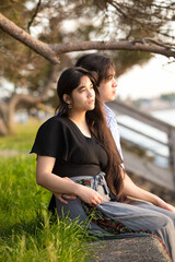 Attractive biracial young couple enjoying outdoors by lake together