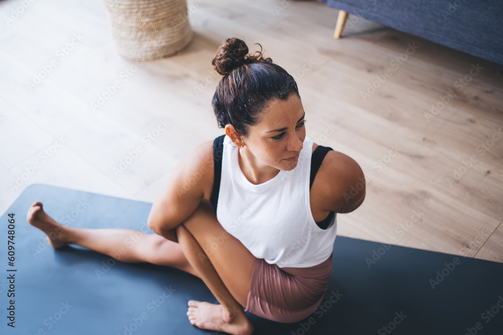 Wall mural young caucasian woman enjoying morning workout for retreat healing in hatha asana mantras, flexible 