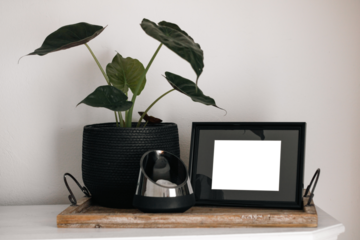 Blank picture frame mockup on white wall / White living room design / View of modern minimalistic style interior with vertical artwork mock up on wall / Home staging and minimalism concept