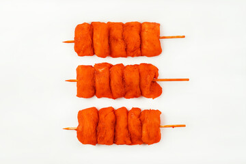 Chicken breast Fillets.Raw marinated chicken fillet skewers on a white background.Marinated...