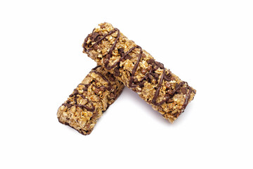 Two bars of whole oatmeal and chocolate on a white isolated background. Delicious healthy snack or energy replenishment. Whole grain energy bars with chocolate