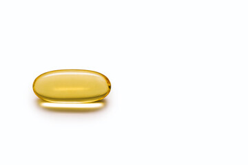 Close-up of a fish oil capsule on a white isolated background. The concept of a healthy lifestyle...