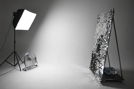 Studio with cyclorama and equipment. Interior of modern photostudio with ventilator professional equipment