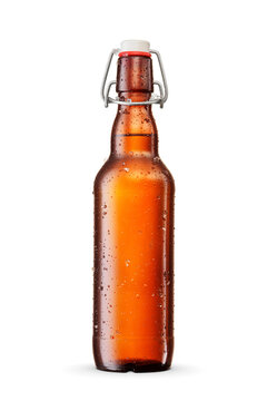 Wet brown beer bottle with flip-top, swing-top cap, ice crystals isolated. Transparent PNG image.