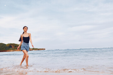 beach woman travel sea running summer young lifestyle sunset wave smile