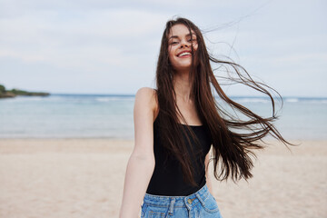 Fototapeta na wymiar woman running sea summer young lifestyle sunset smile beach travel hair
