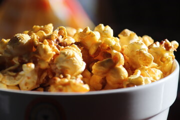 popcorn It's a snack. Made from corn kernels Now known to many peoples. Popcorn originated in the territory of the Indians in the Americas. since about 5,600 years ago