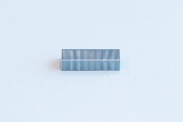 Metal staples (stapler) small on a white background. Used for joining or bundling materials...
