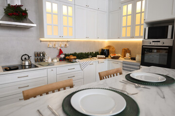 Cozy kitchen decorated for Christmas. Interior design