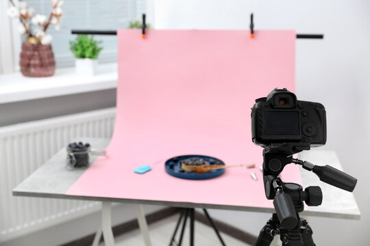 Professional equipment and composition with delicious dessert on pink background in studio. Food photography