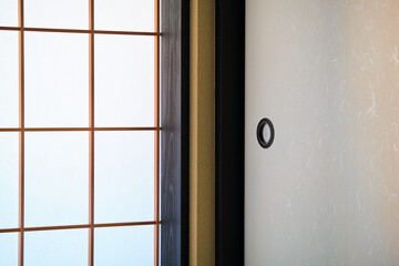 Shoji traditional Japanese window, door and room divider made of translucent sheets on a lattice frame.