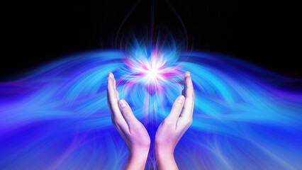 Aura phenomena. Woman with flows of energy making beautiful pattern between her hands against black...