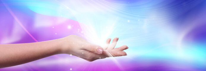 Aura phenomena. Woman with flows of energy and lights around her hand against color background, closeup. Banner design