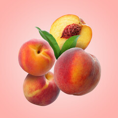Juicy fresh peaches with green leaves falling on pink background
