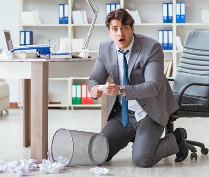 Angry businessman shocked working in the office fired sacked