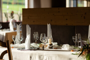 Decorated Gala dinner table with wine glasses and decorative napkins for a wedding
