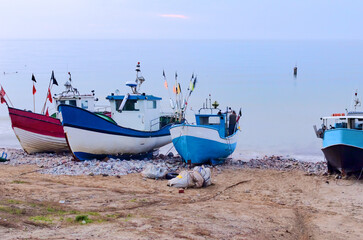 Naklejka na ściany i meble Fishing Boats and Small Ships Parked by the Sea