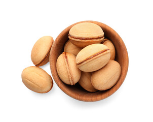Delicious nut shaped cookies with boiled condensed milk in wooden bowl on white background, top view