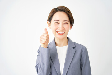 グッドサインするビジネスウーマン　白背景