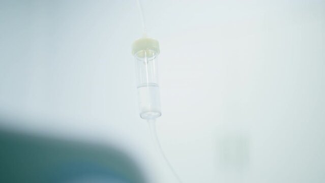 Intravenous saline bag in the operating room before the start of a surgical procedure in a medical clinic