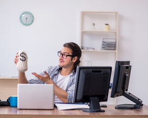 Young male it specialist working in the office